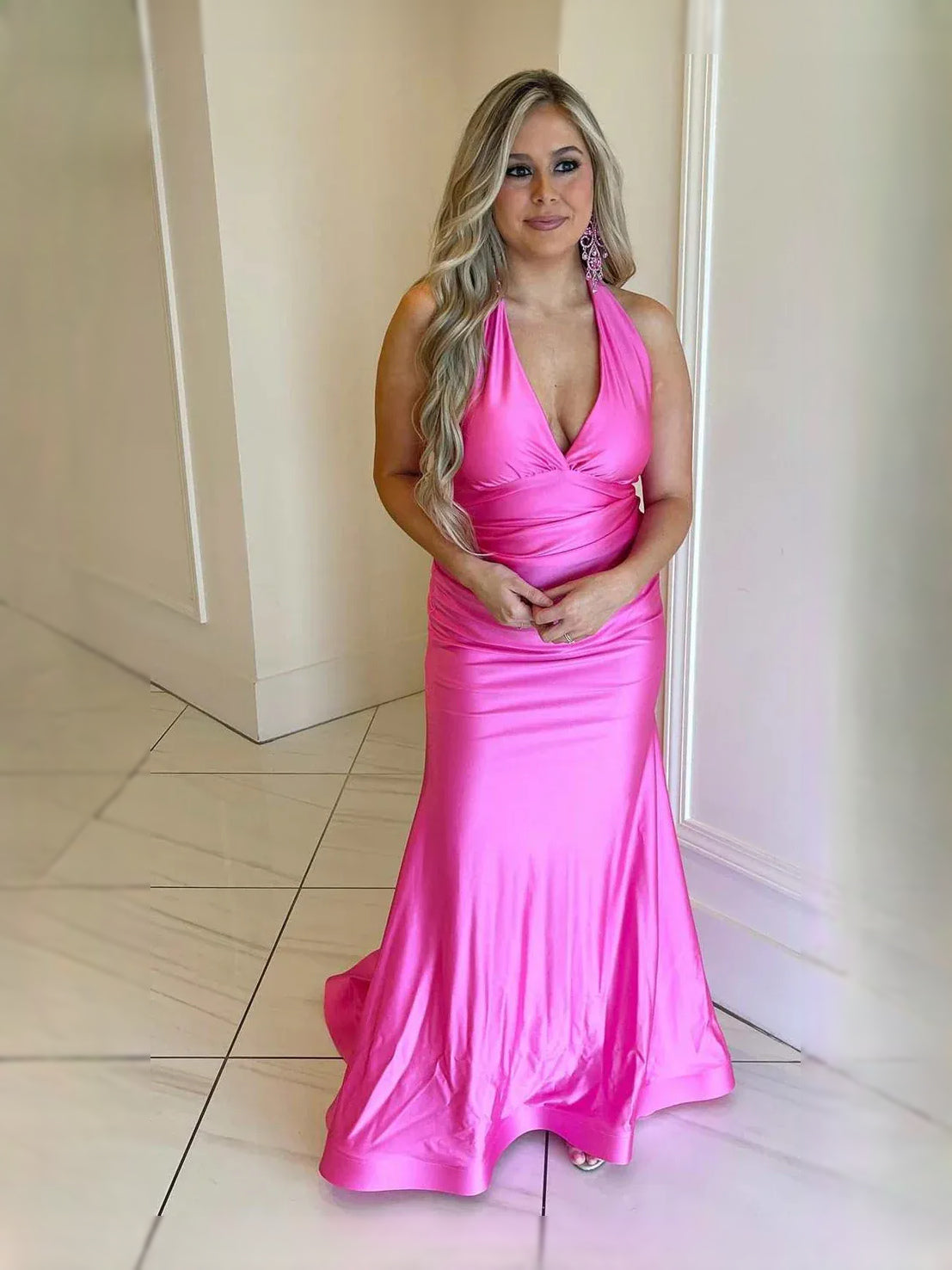 Hot pink satin mermaid prom dress with ruched V-neck and draped open back, full length