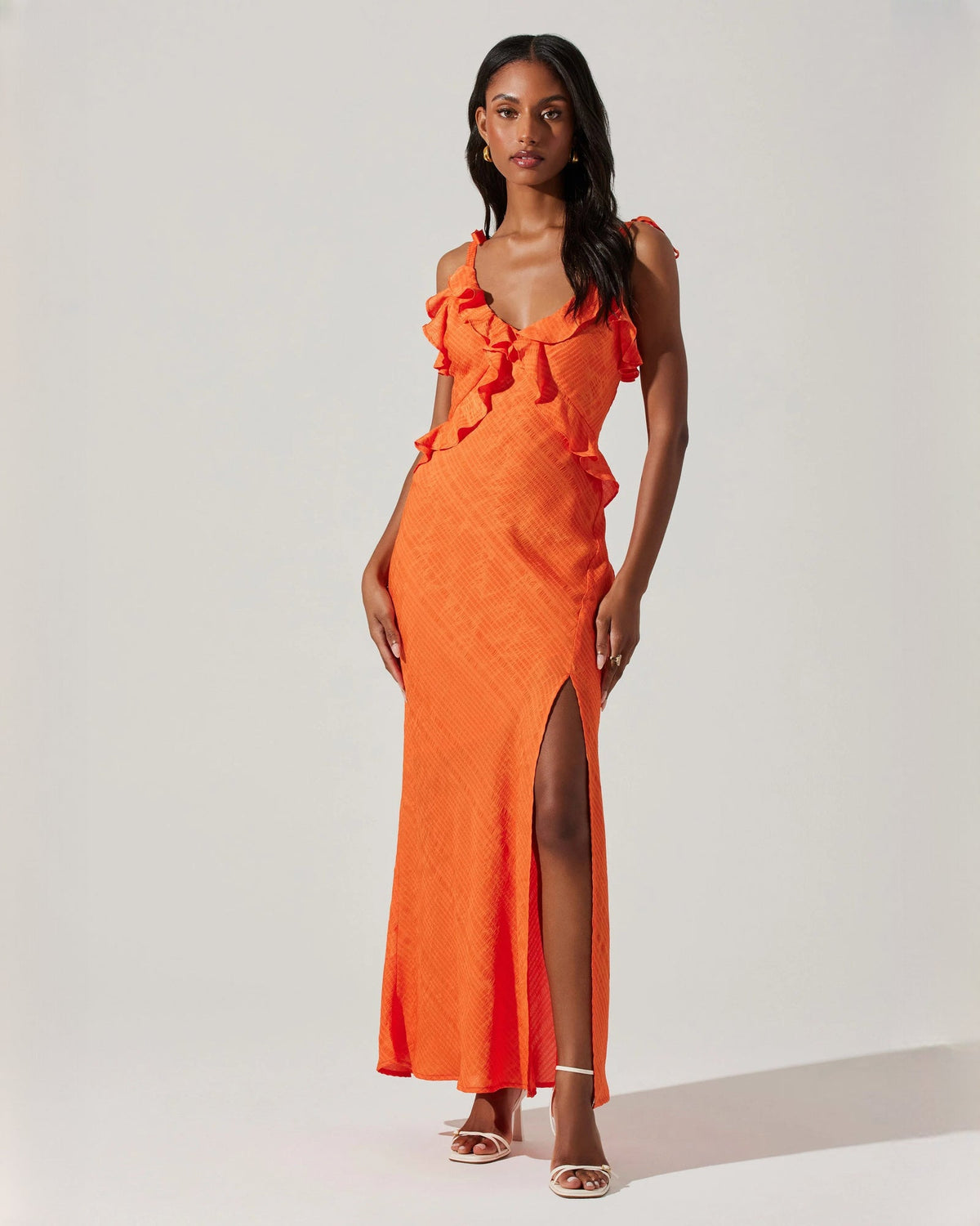 Orange sleeveless satin A-line maxi dress with ruffled neckline and high slit