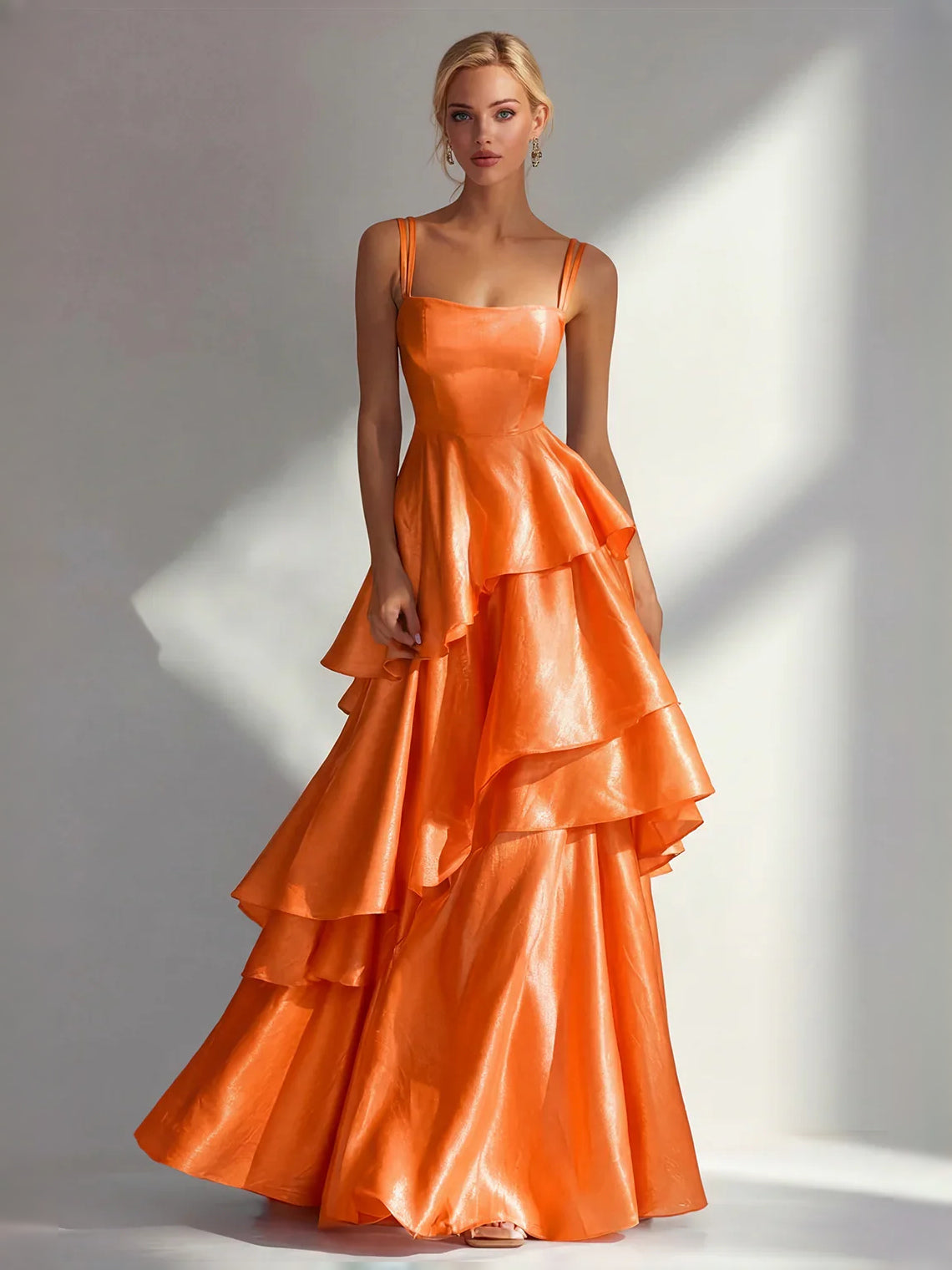 Burnt orange satin prom dress with square neckline, spaghetti straps, tiered ruffle A-line skirt