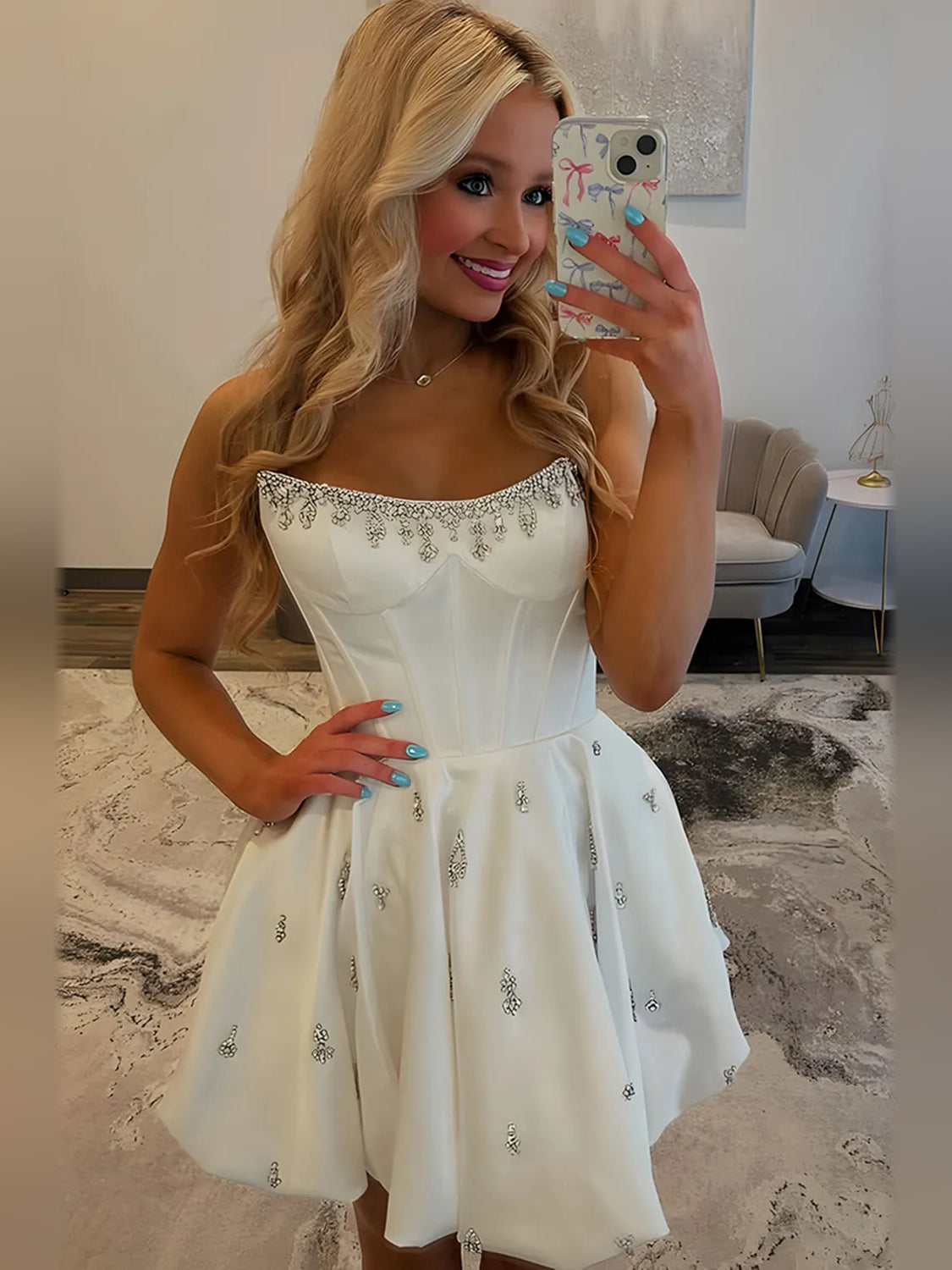 White satin mini dress with sweetheart neckline, corset waist, and crystal embellished bodice