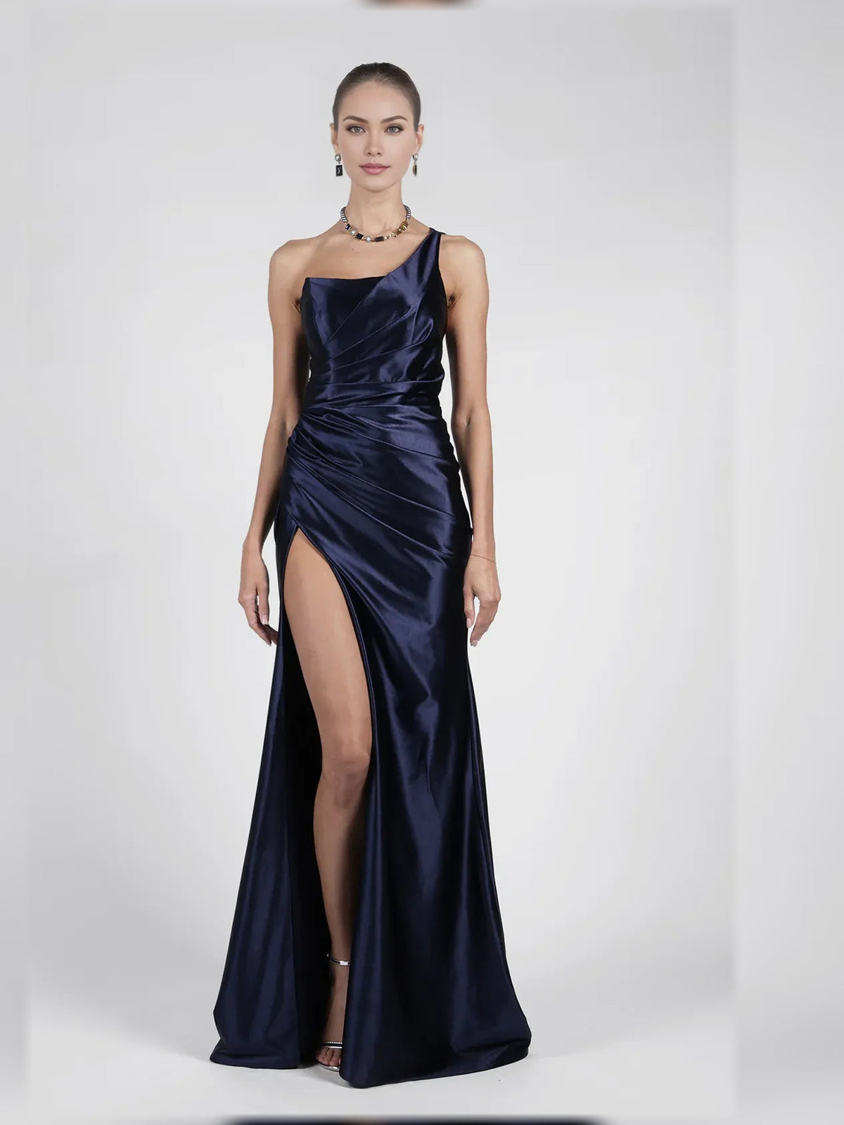 Navy one-shoulder ruched formal gown with leg slit and smooth satin skirt