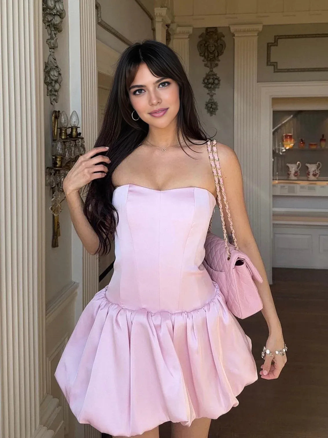 Pink strapless corset mini dress with sweetheart neckline and pleated puff skirt