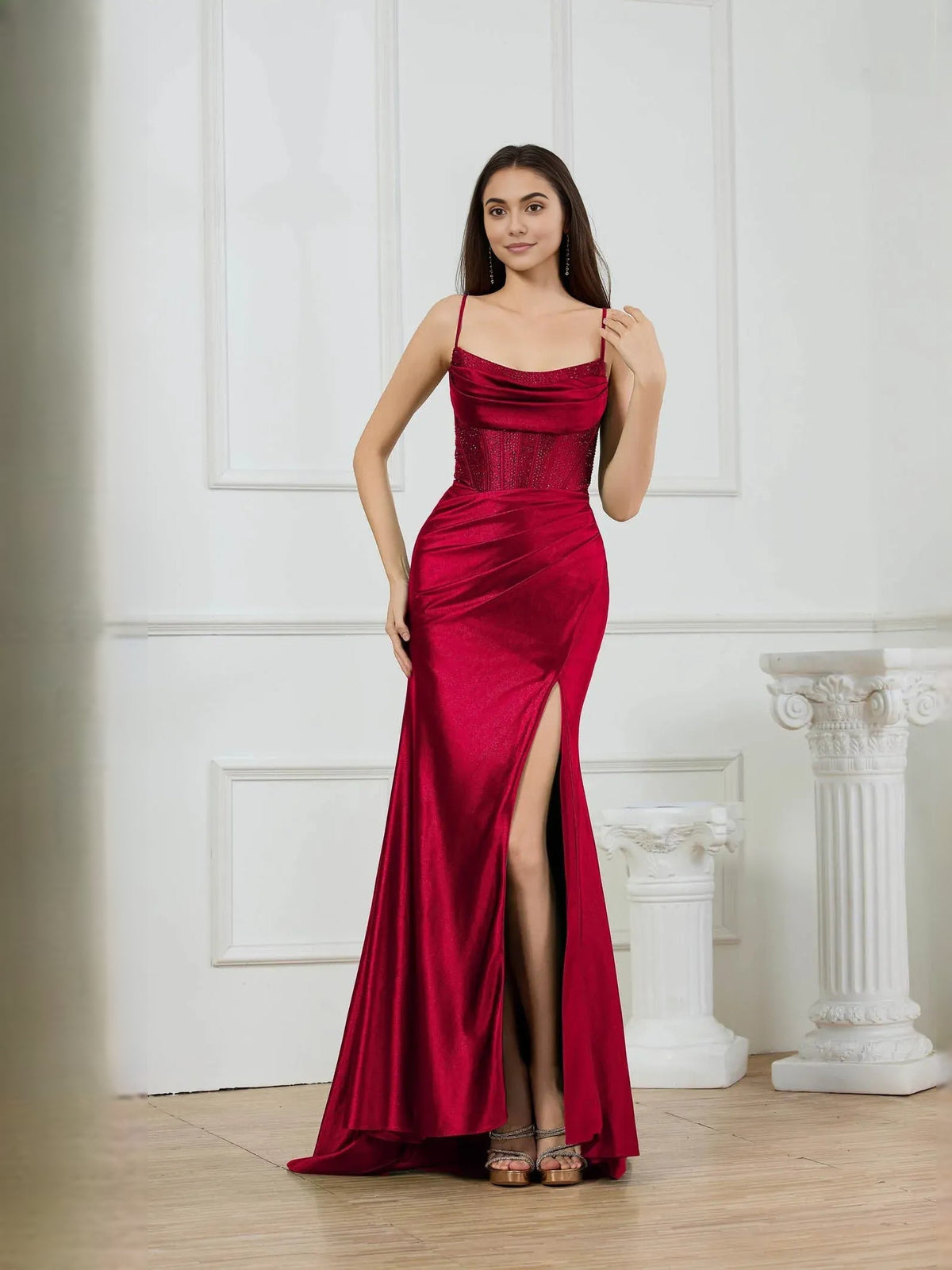 Red mermaid formal dress with corset bodice, cowl neckline, and thigh slit