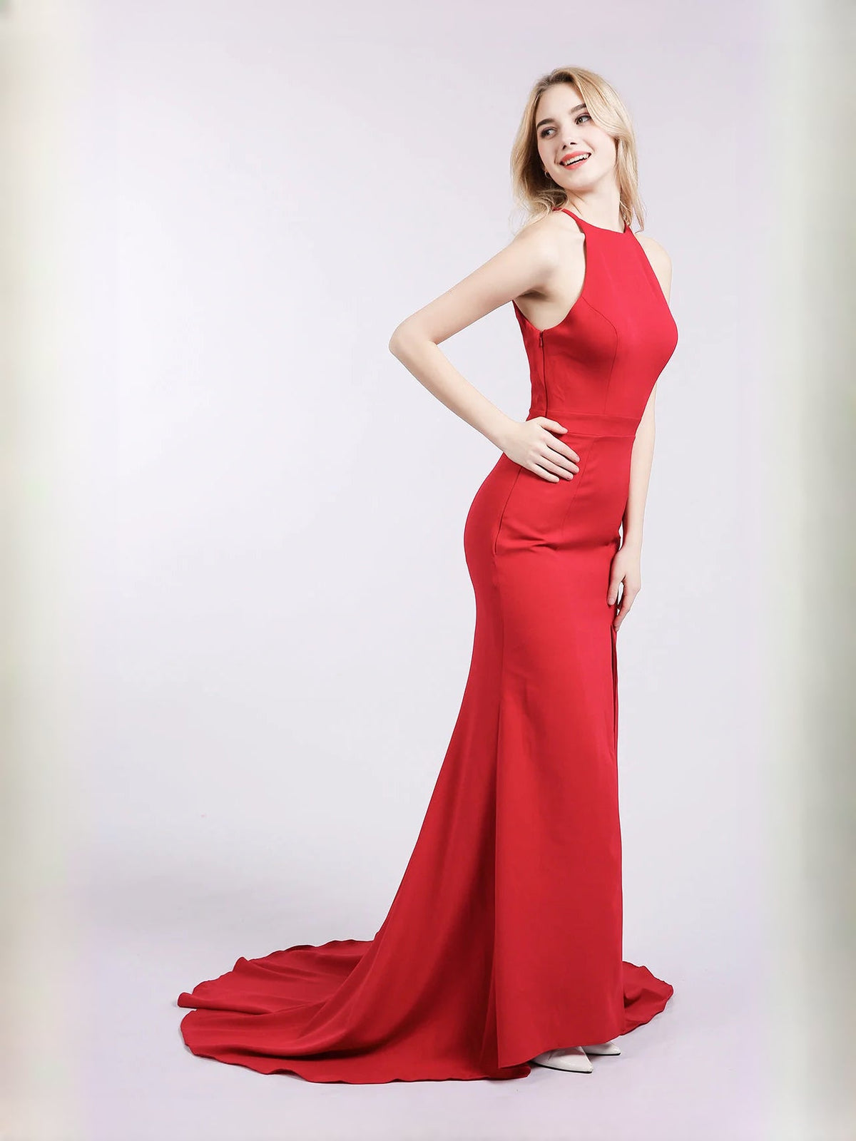 Red satin halter mermaid prom dress with front slit and flared ruffle hem