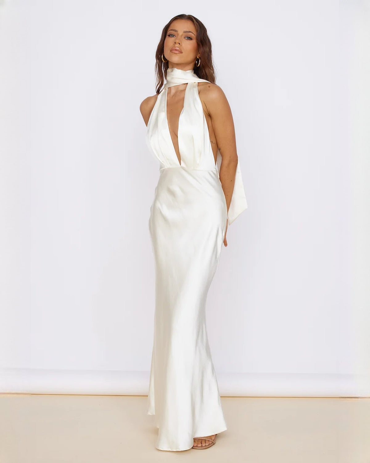 Ivory satin sleeveless A-line maxi dress with keyhole halter neckline and open back drape