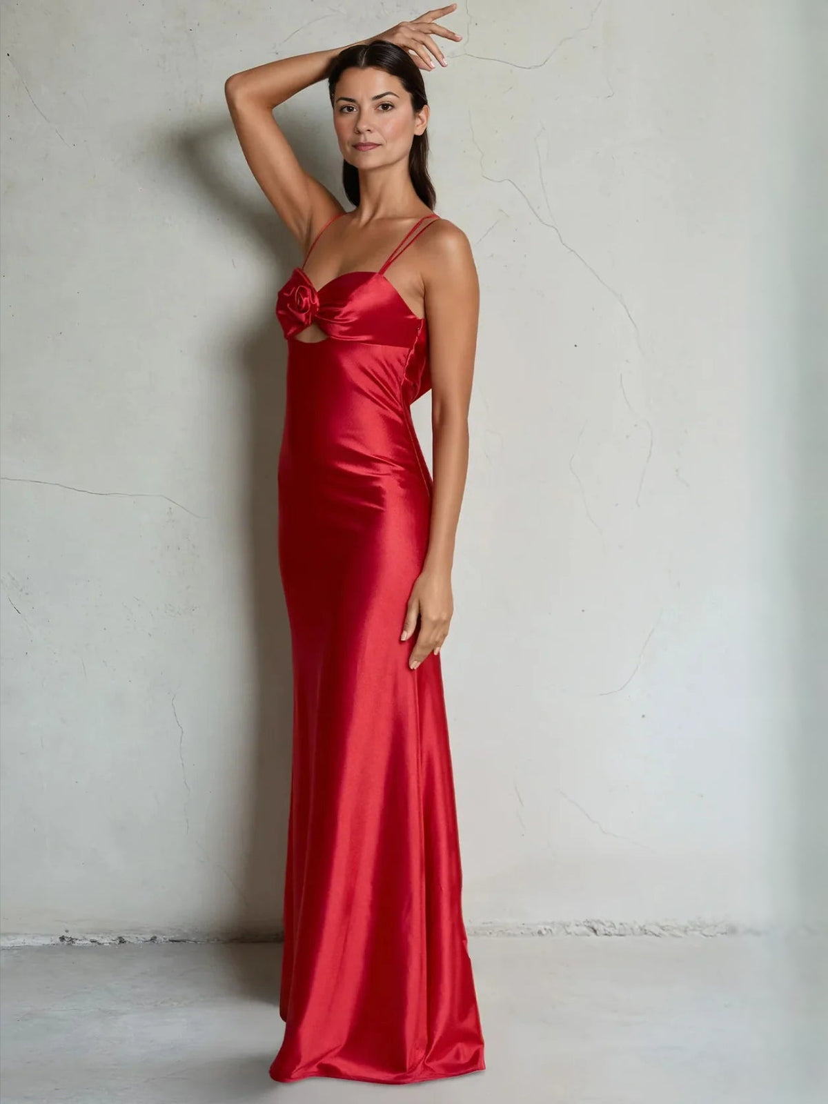 Red satin mermaid prom dress with sweetheart neckline and rosette detail at the chest