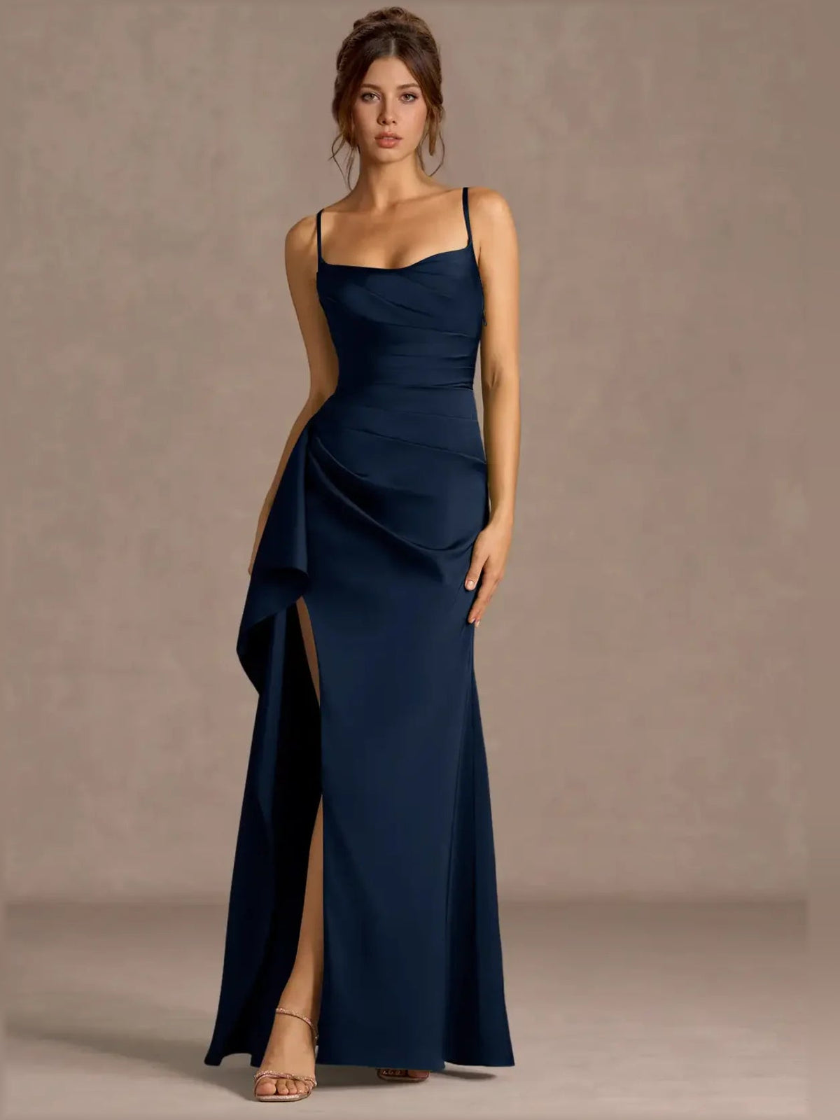 Dark navy sweetheart formal dress with spaghetti straps, ruched waist, and thigh slit.