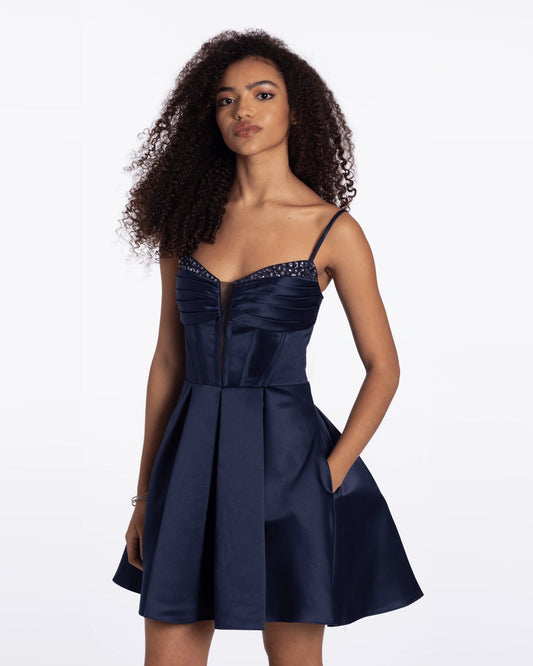 Navy satin fit-and-flare dress with spaghetti straps and pleated A-line skirt, front view