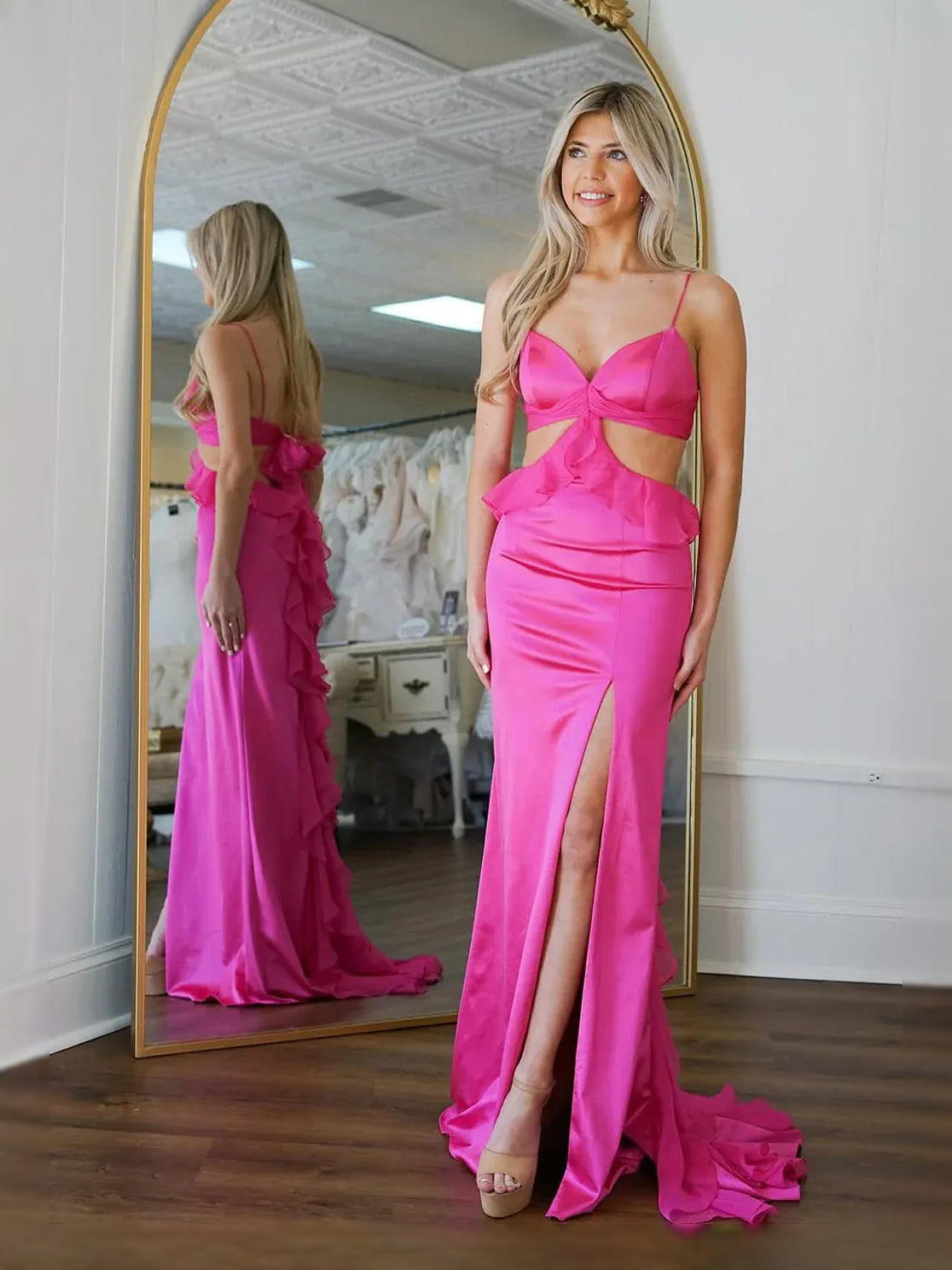 Fuchsia satin sweetheart prom dress with bow top, ruffled detail, and thigh-high slit