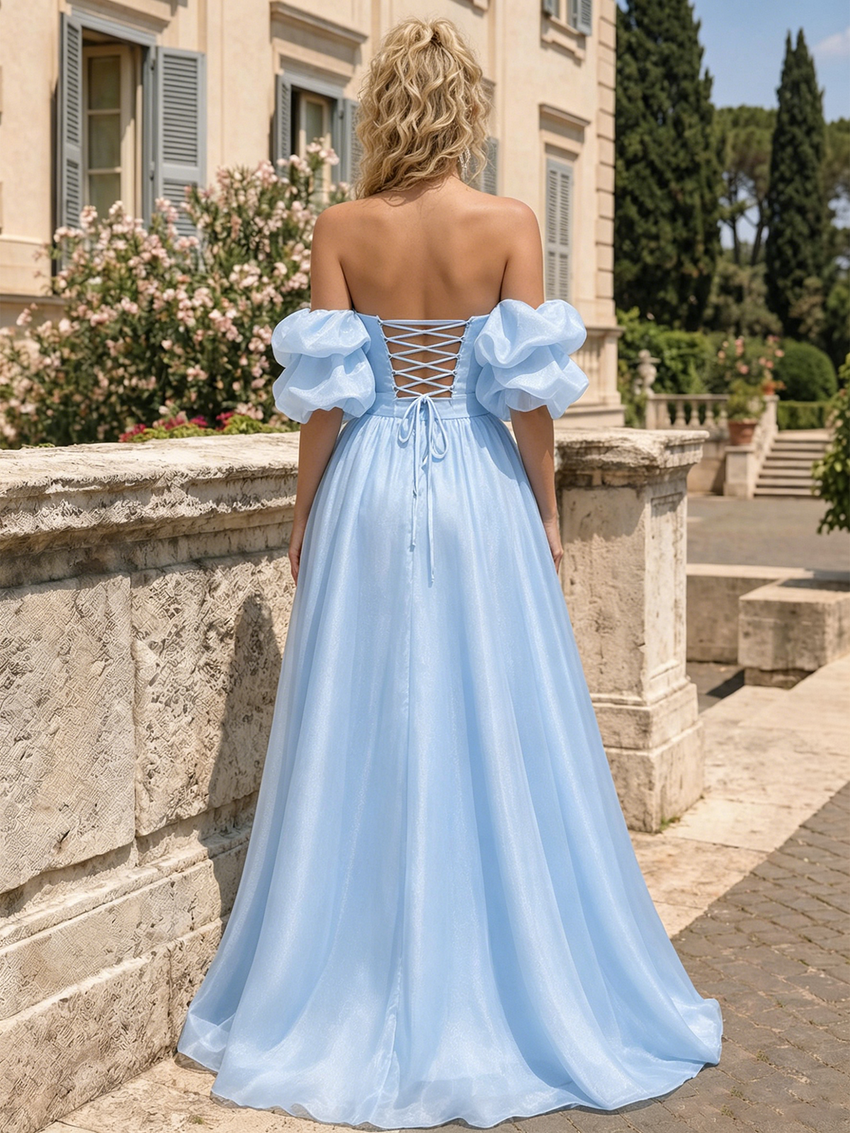Sky-blue open-back A-line prom dress with crisscross back detail and puff sleeves